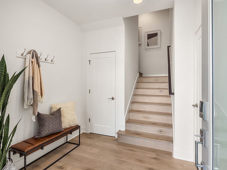 Entry on Ground Level - Also access to Garage - Beautiful Hardwood Floors and Stairs - Modern Entry Door with Ring Camera