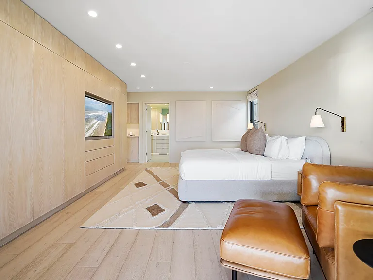 Every detail is curated_from the tailored built-ins to the inviting leather lounge chair.