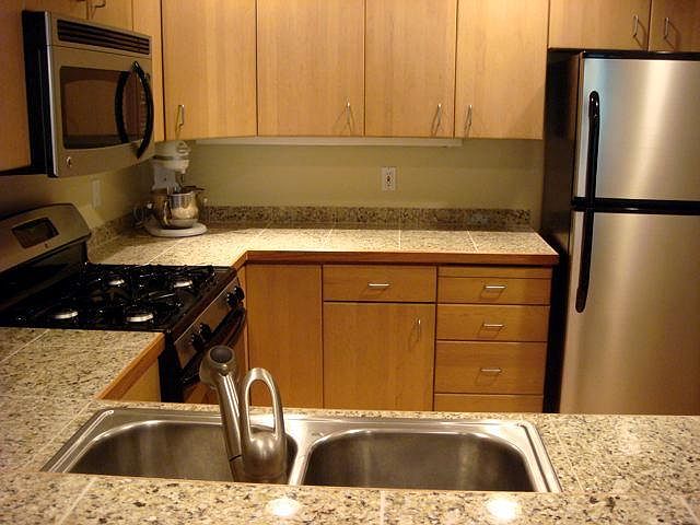 Newly updated kitchen with granite counter tops and stainles