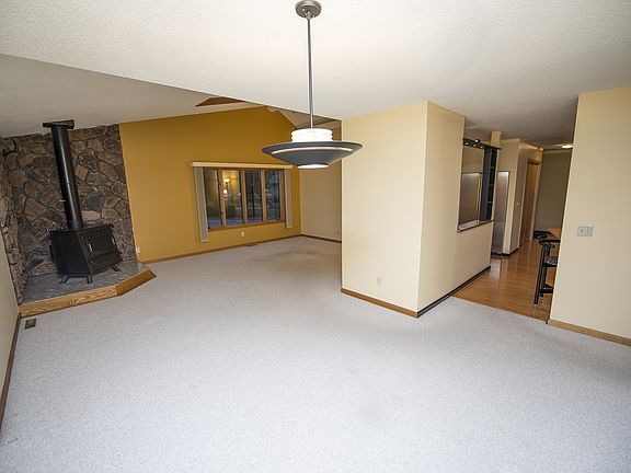The open dining room (11x10) connects the living room, kitchen, and bedroom corridor.  Of course, if a formal dining area isn't needed this space could serve a myriad of other purposes.
