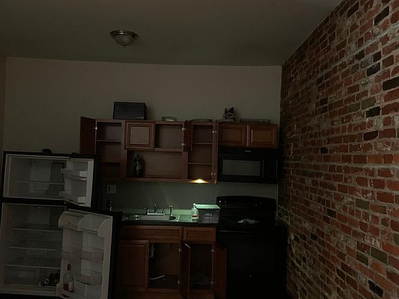 Hardwood floors, exposed brick walls, open floor plan, large bedroom, plenty closet space.