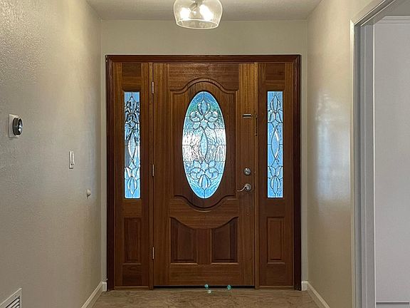 Front Hallway with new modern light fixture installed.