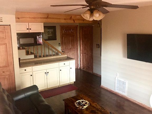 Living room has extra bed & lift top coffee table.