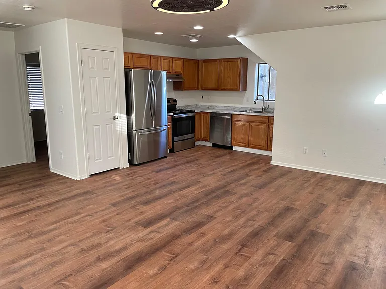 Kitchen with new appliances open to living room