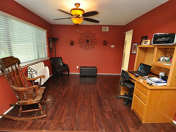 Space may be used for formal dining room or study. Laminate wood floors and fixtures updated!