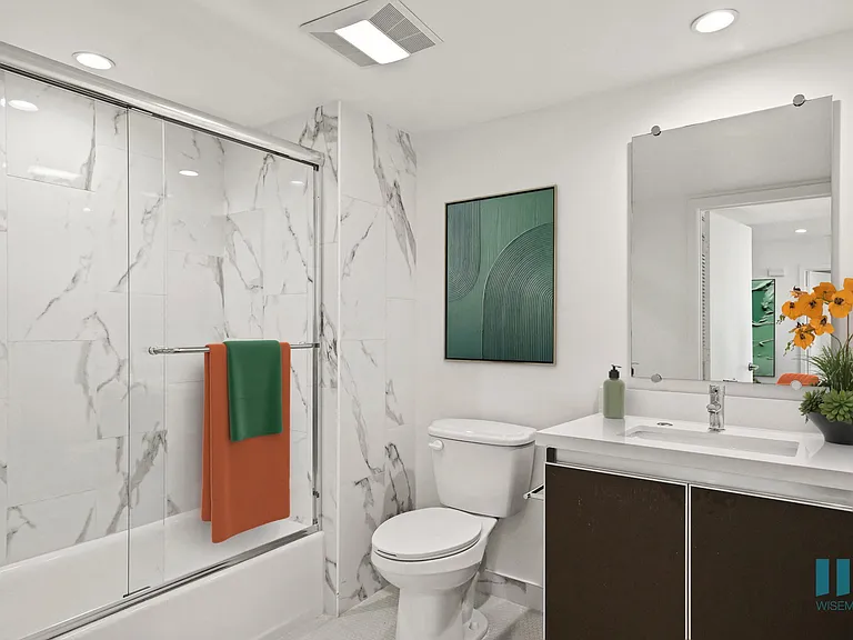 Bathroom with Shower-Bath with a Glass Door and Vanity Cabinet Storage