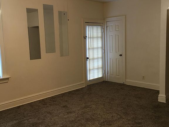 Living room 20 x 11 features door to upper front porch, as well as a closet