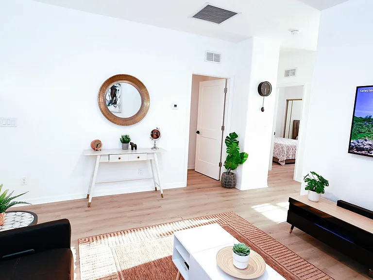 You'll find a spacious living room area with coffee table/workstation, 60" Smart TV display with your favorite streaming apps, and lots of books and board games.