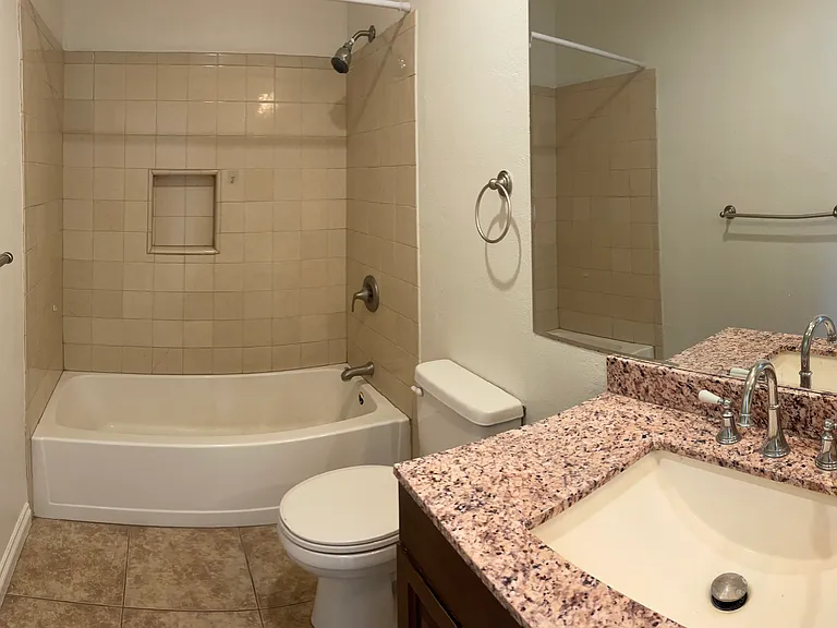 Full bath with granite counter top