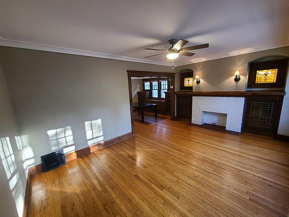 Leaded glass, built-in china cabinets, and a faux fireplace bring that "old school" charm