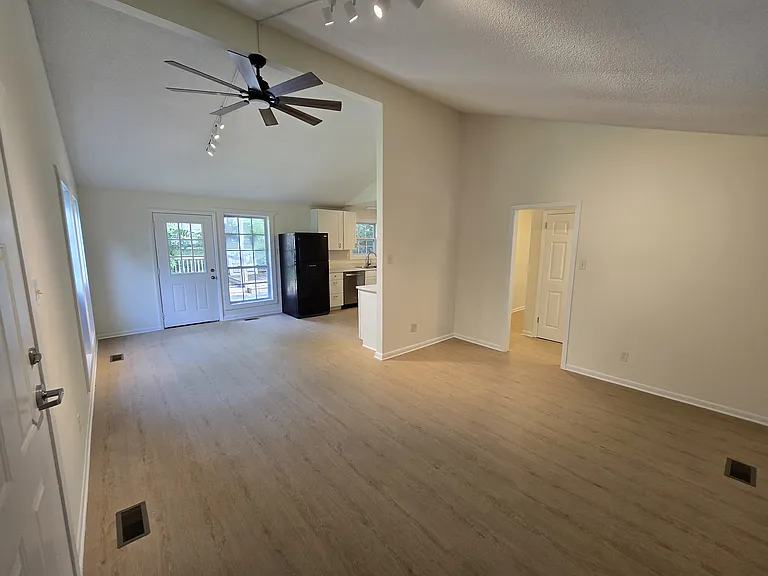 Dining area, kitchen, and living room.