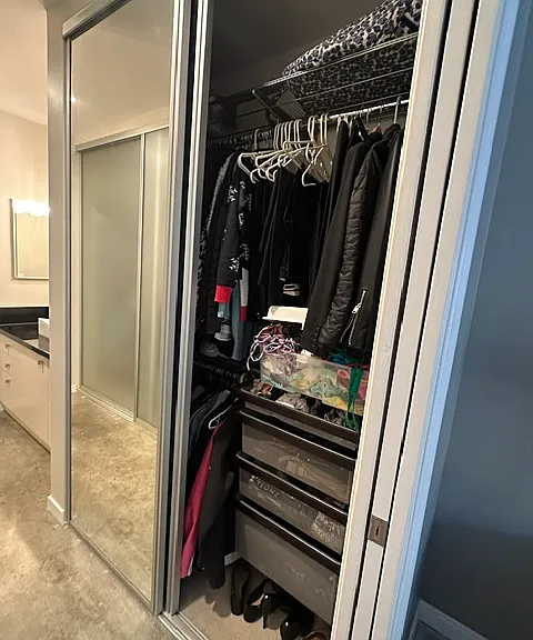 Custom master closet with drawers, bars and shelving (mirrors on exterior) - right side