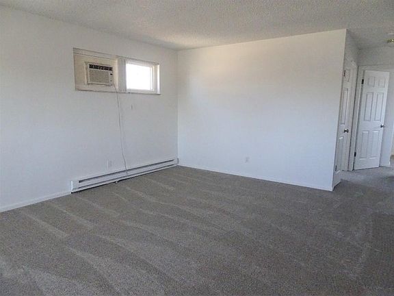 from the front door with the linen closet visible on the right