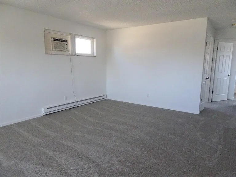 from the front door with the linen closet visible on the right