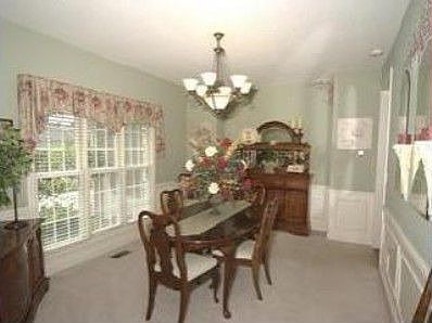 Beautiful formal dining room with wood trim!