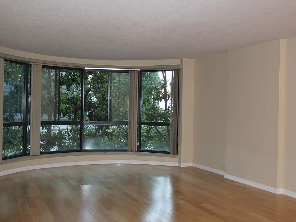 Living room,- tall windows facing the courtyard.