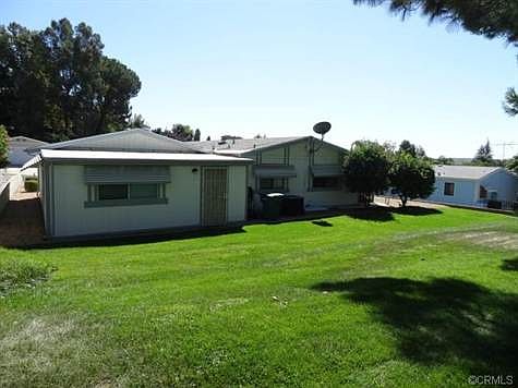 VIEW OF BACK OF HOME ON THE GREENBELT
