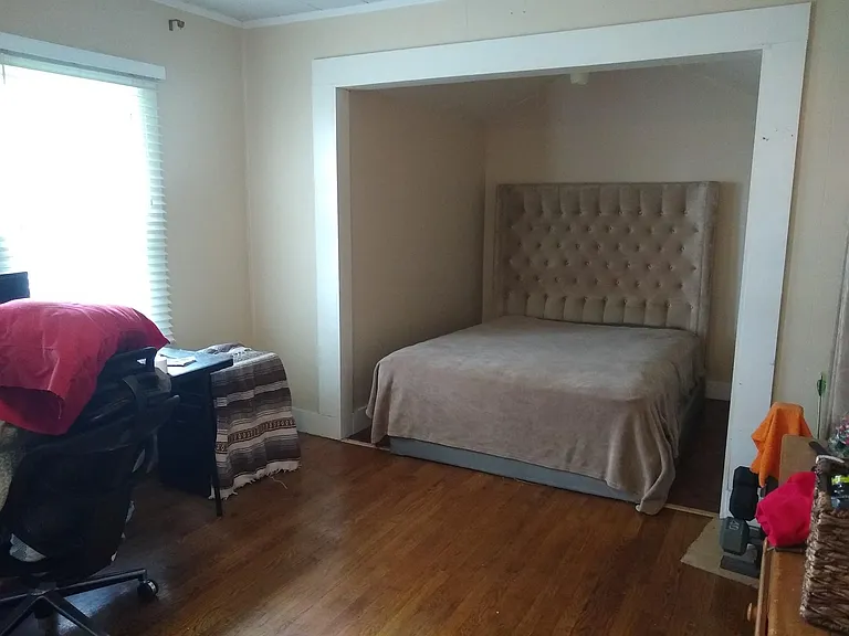 Bed nook with previous tenant's bed (no furniture is staying - this is just so you can see it fits a queen nicely)