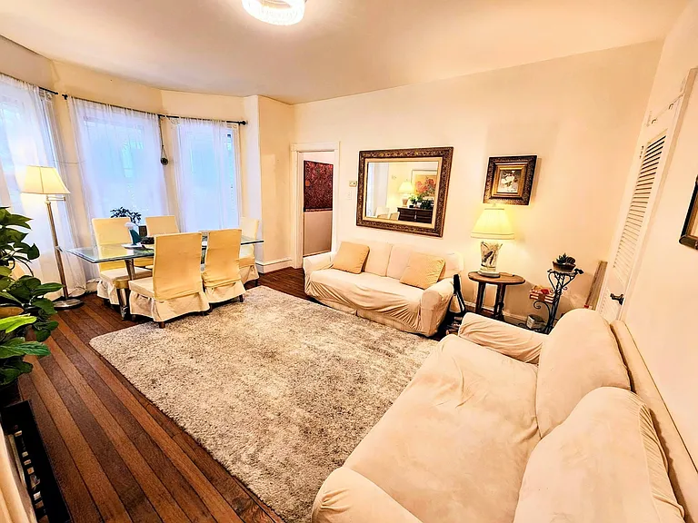 Sun-filled family room/dining room with hardwood floors