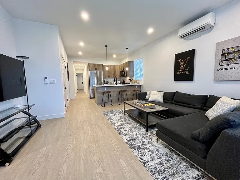 Casual sophistication: Enjoy an open living space where a beautiful countertop becomes a central hub for both kitchen and dining experiences