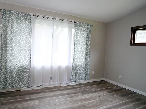 Large upstairs living room with lots of light and high ceilings leads into your dinning space and kitchen