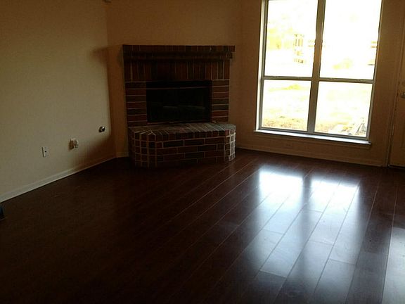 Nice open floor plan with laminate wood floors.