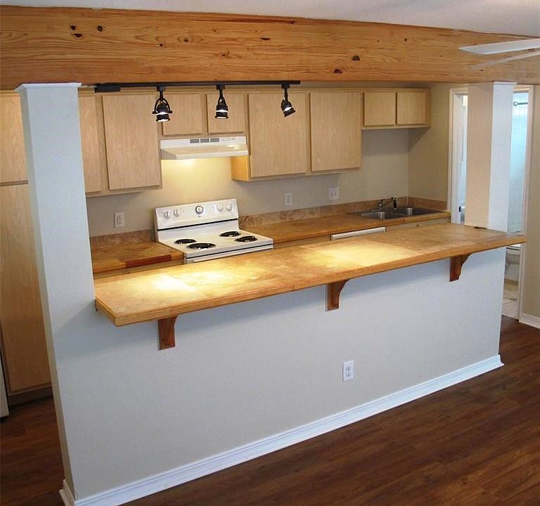 Lots of counters and cabinets, dishwasher and garbage dispos
