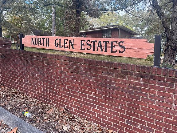 Neighborhood sign in front of house