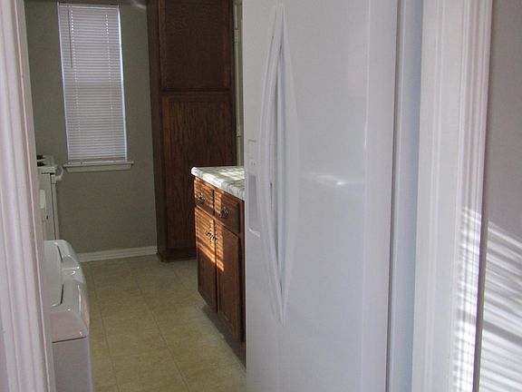 Kitchen - side by side refrigerator - counter top microwave next to fridge - not seen in picture