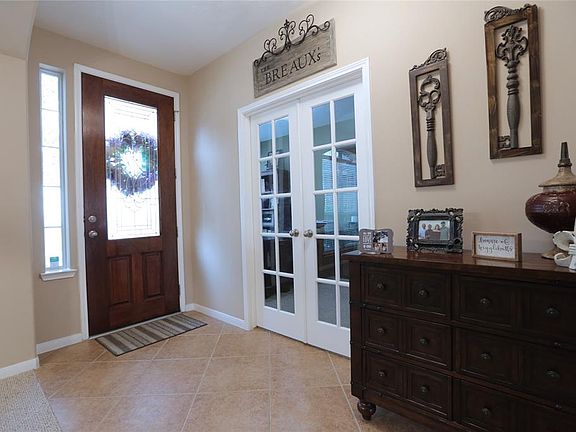 The spacious entry is welcoming, and the study has double french doors for ample privacy.