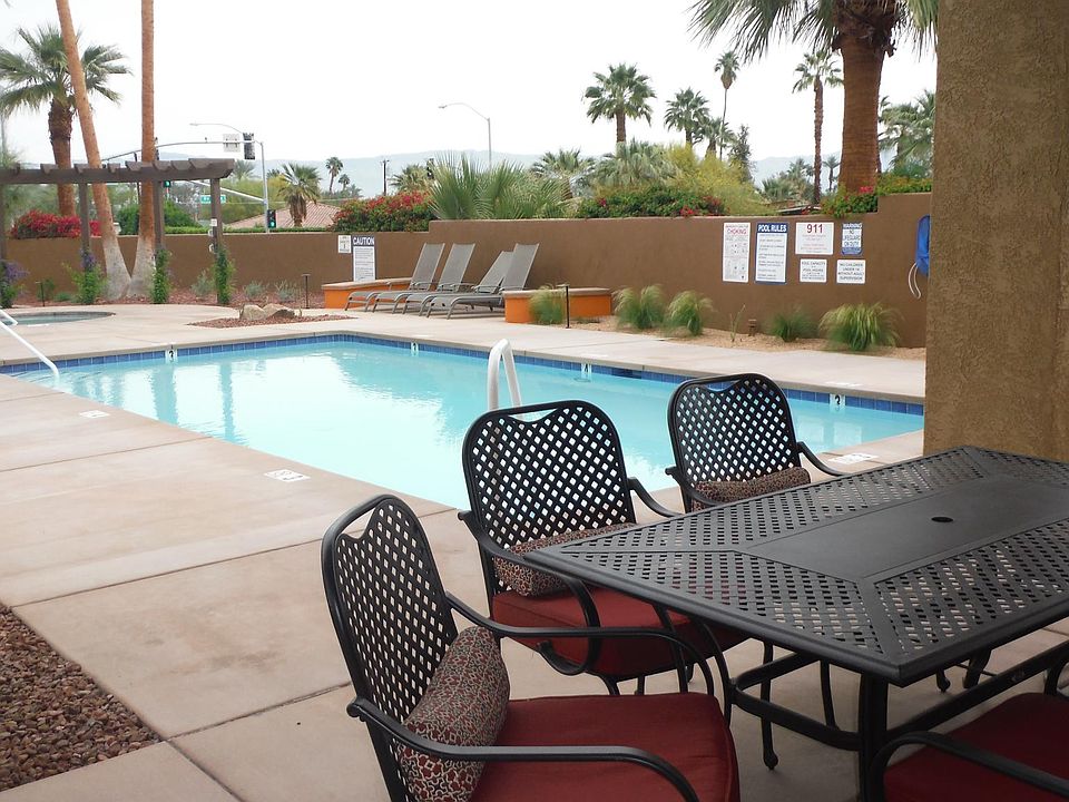 Table & 6 chairs next to the pool