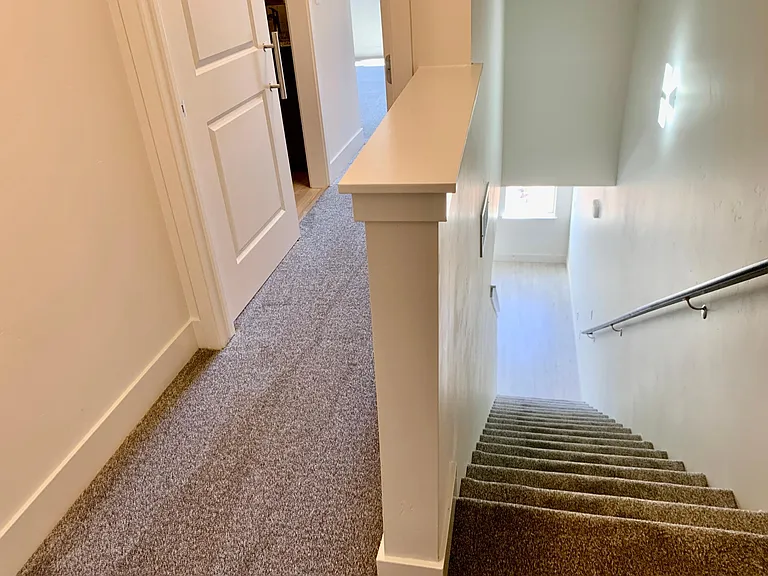 staircase leading from lower level up to main living area