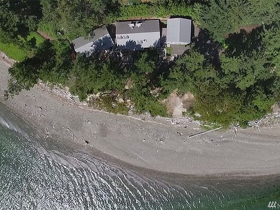 This special residence sits on a shy one acre of low and medium bank property with 430 feet of beachfront.  A short trail leads from the home to the beach.  