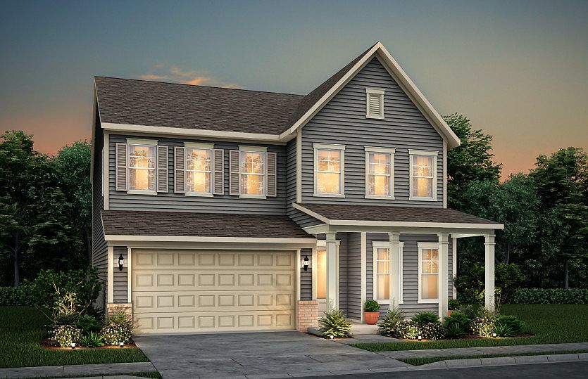 Continental exterior 17 features siding, brick accents, covered front porch and 2 car garage