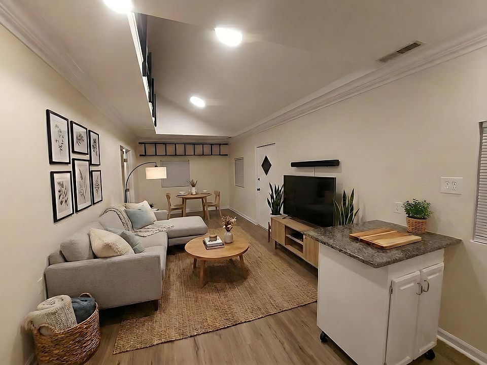 Living Room.
Included in this room is the kitchen island with storage on both sides, TV and sound bar with subwoofer.

Room has been virtually staged. All fixtures, finishes and appliances are true to life.