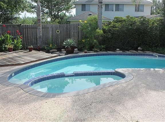 ENJOY A COOL SUMMER BREEZE IN THE GLISTENING PRIVATE POOL AND SPA