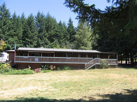 Rear of house showing expansive deck. Great for entertaining or relaxing.