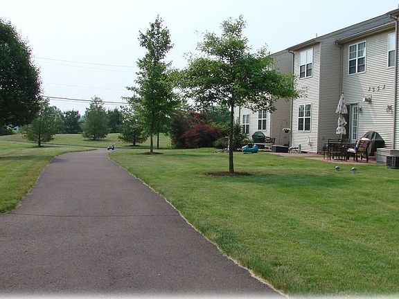 Rear walkway leads around neighborhood