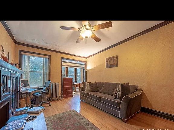 LR with antique built-in bookcase and decorative fire place