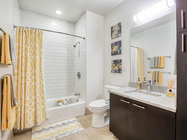 Modern, spa-inspired bathrooms with generous cabinet space
