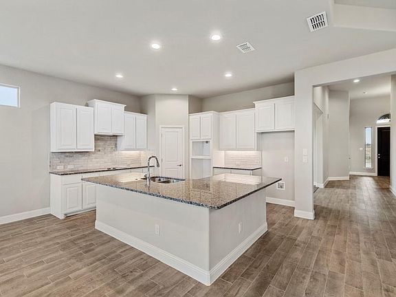 Photos shown here may not depict the specified home & features included are for illustration purposes only
