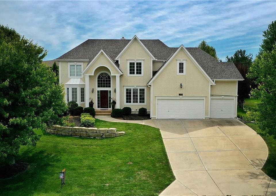 Amazing & updated front elevation including new trim, new exterior paint, new landscaping. COME BACK AND SEE ALL THE UPDATES!