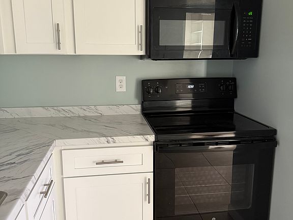 New kitchen cabinets , new counter tops, newer stove and microwave