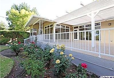 #2  Back of house showing covered veranda