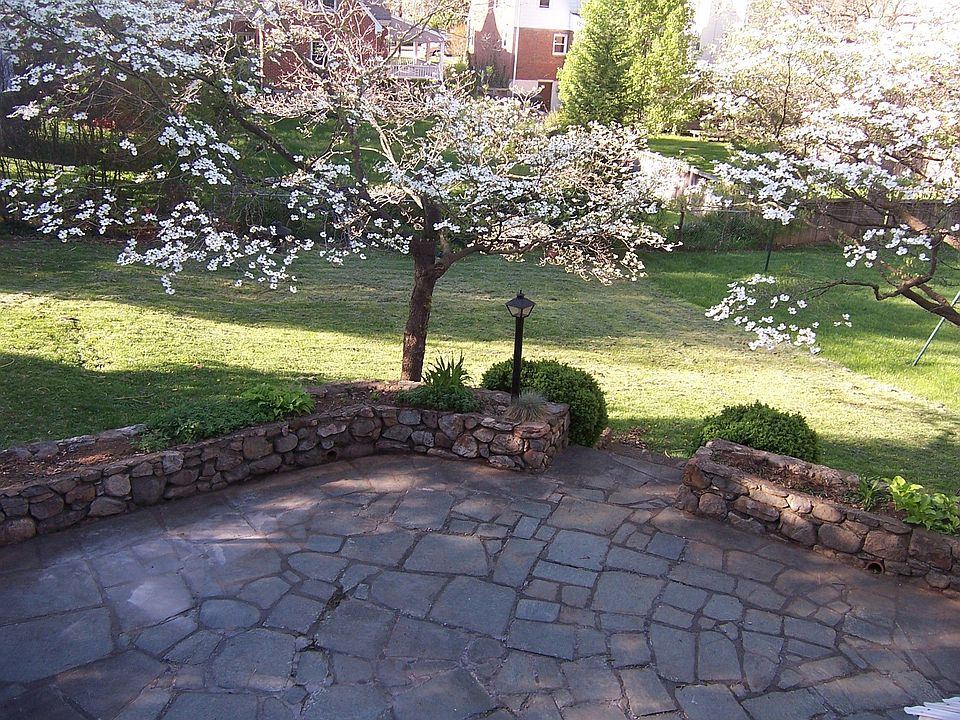 Slate patio w/stone wall