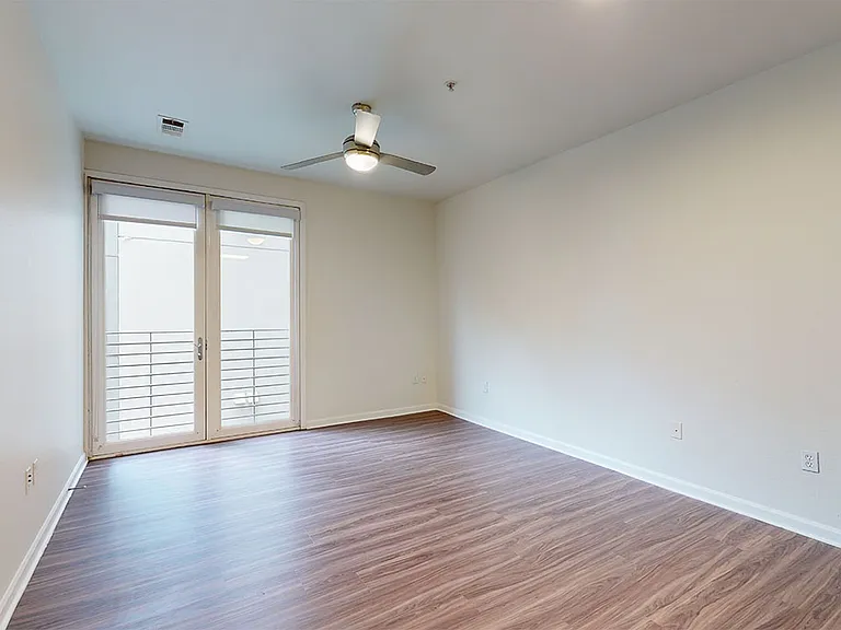 Apartment living room with wood-style flooring.