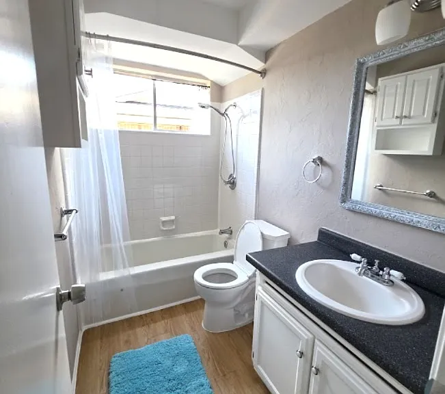 Large bathroom with storage. Shower equipped with a new long handheld spray with 10 functions.