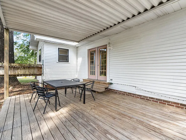 covered deck inside fenced yard