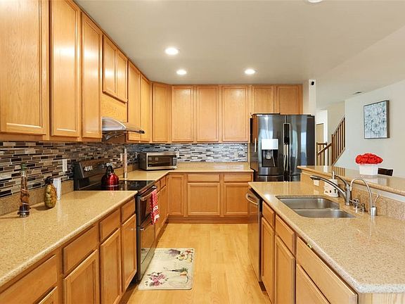 Kitchen with granite counter tops.