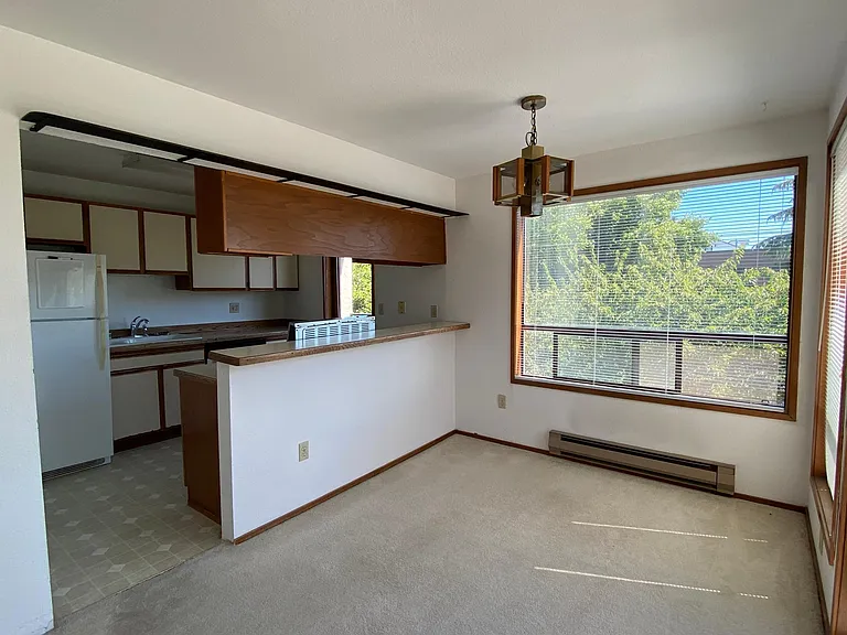 Kitchen with eating bar opens to the 2nd deck.